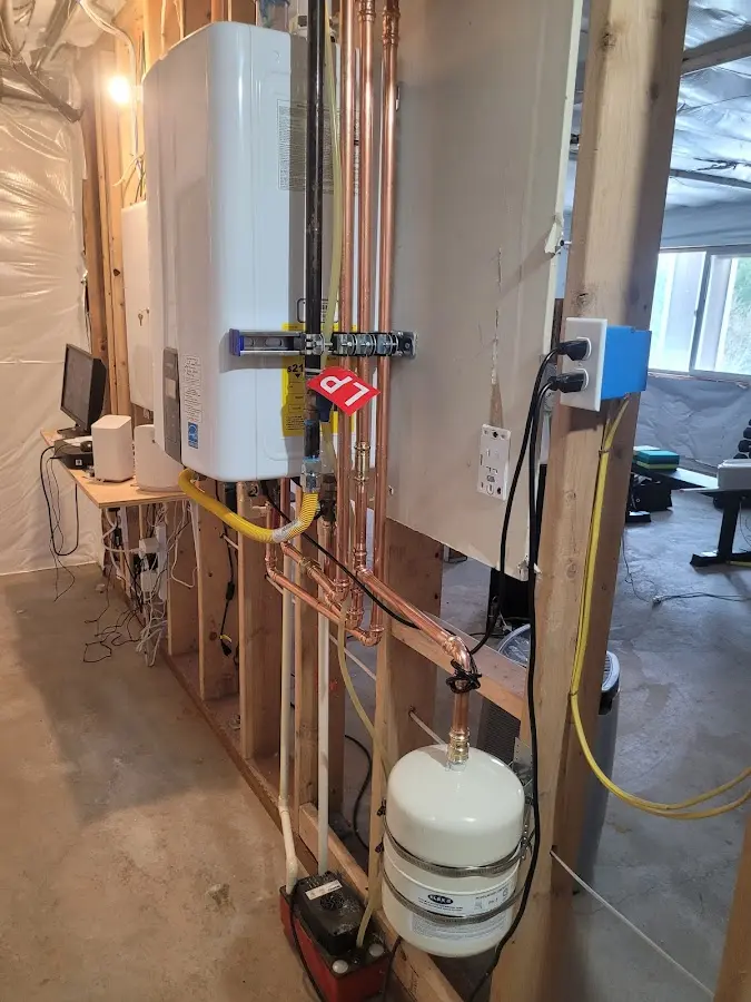 Licensed plumber repairing a kitchen sink in Plumstead